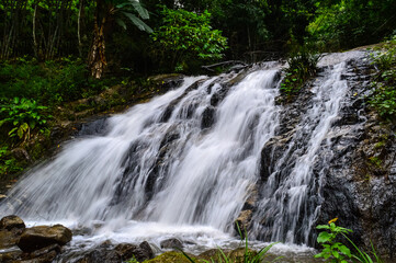 Fototapeta premium Beautiful Small Waterfall in summer Forest in jungle at Doi Saket Distric, Chiang Mai, Thailand