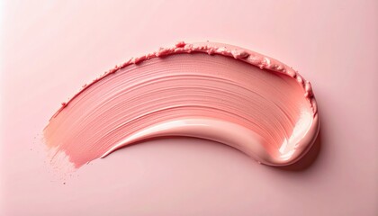 Applying soft pink creamy texture on smooth surface studio setting beauty product minimalist environment close-up view aesthetic appeal