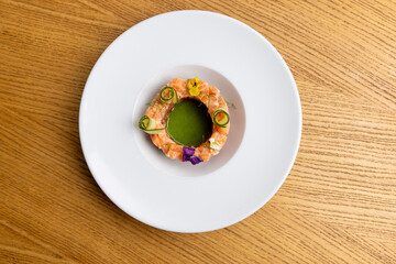 Top view of a salmon tartare with garnish