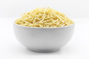 STRAW POTATOES IN A WHITE BOWL WITH ONION AND PARSLEY FLAVOR ON AN ISOLATED WHITE BACKGROUND