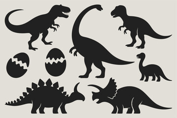 Collection of solid black dinosaur shapes including baby adult forms and eggs on a clean light background
