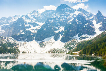 landscape with lake in tatra mountains of poland in spring. beautiful travel destination of europe. outdoor adventure and vacation season on morskie oko © Lesia