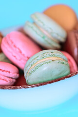 Cake macaron or macaroon on turquoise background