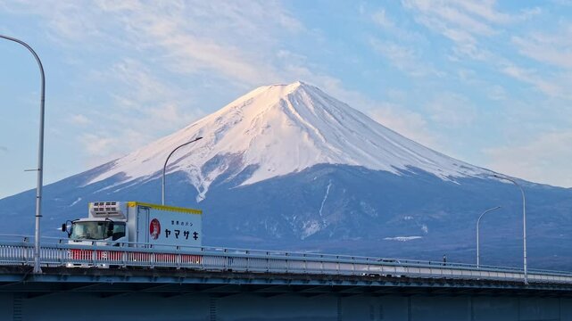 Aerial drone view of the Kawaguchiko-Ohashi bridge near the Fujikawaguchiko town in Japan with Mount Fuji on the background