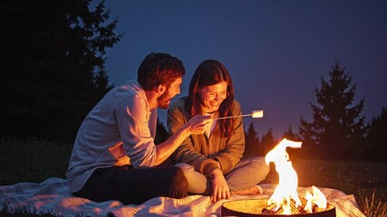 Romantic couple enjoying a cozy night by the bonfire, roasting marshmallows and sharing laughter - Powered by Adobe