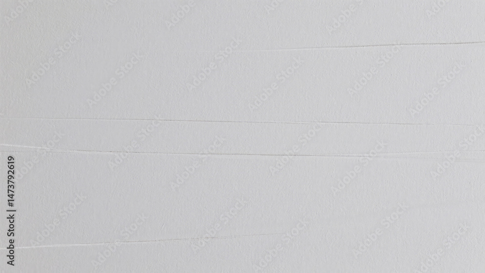 Poster textured light gray surface showing horizontal folds suggesting layers and subtle shadows