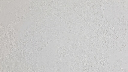 Obraz premium Textured white plaster wall with subtle details and a natural matte finish