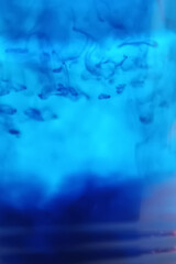 abstract image of blue droplets in water
