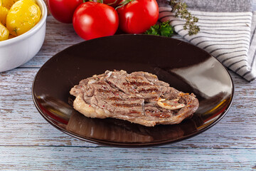 Grilled lamb steak with bone