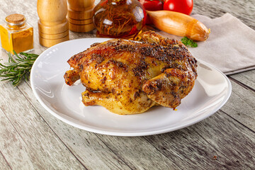 Baked in oven whole chicken with spices