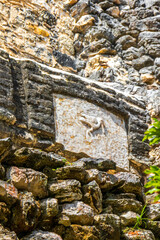 Ancient Mayan site with temple ruins pyramids artifacts Muyil Mexico.