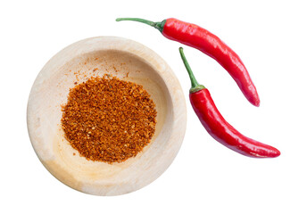 red hot chili powder on wooden bowl isolated on white