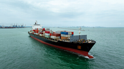 container ship carrying goods for international import export, business and industry regarding...