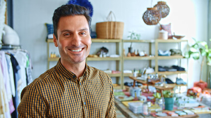 Portrait Of Smiling Male Owner Or Sales Assistant In Shop