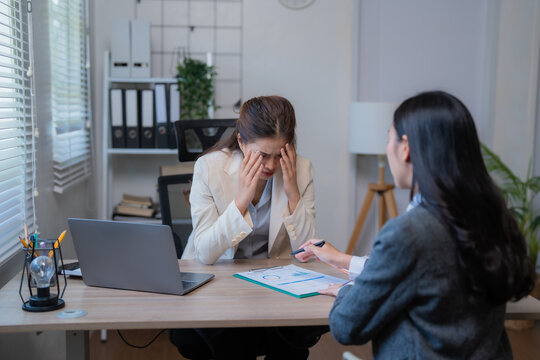 Businesswomen discussing over financial chart and arguing about investment risk while working together in modern office, business negotiation concept