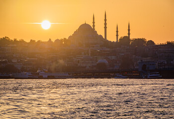 Sunset cityscape of the Historic Peninsula area across Bosphorus Strait by Galata Bridge with the...