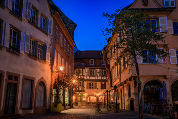 Obraz premium Ornate facades of the traditional half timbered houses in the Little Venice district in Colmar, picturesque village in Alsace France at sunset