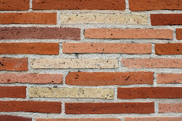 Obraz premium Mur de briques de couleur rouge, rose, orange