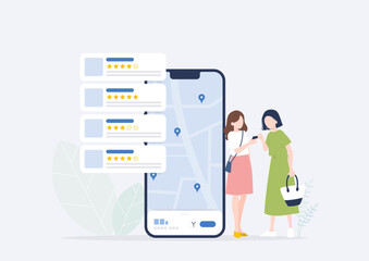 スマートフォンを使って人気のお店を探す2人の若い日本人女性