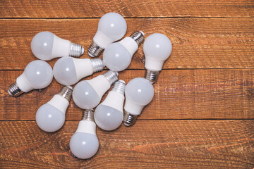 A pile of LED lamps lie on the table