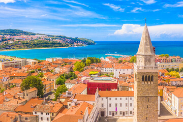 Aerial view of the city of Koper on Adriatic coast, Slovenia, showcasing its historic old town, and surrounding blue waters in a blend of cultural heritage and Mediterranean charm