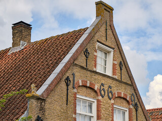 Historic 1669 gable of Dutch house in Puttershoek harbor, the Netherlands