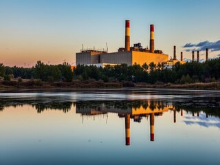 Obraz premium Sustainable Manufacturing at Dusk Reflects on Water