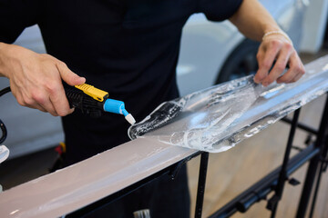 Applying a Protective Film on the Surface of Your Car for Enhanced Durability and Shine