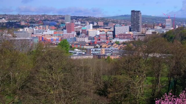 Aerial video of Sheffield skyline from the vantage point of Norfolk heritage park on a Spring day