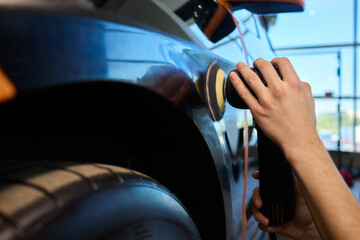 A Detailed Close Up of the Car Polishing Process in the Field of Automotive Detailing