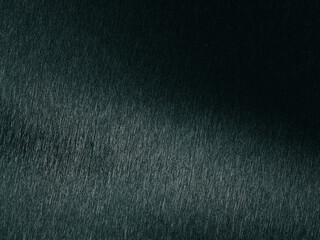 Dark green textured background creating a gradient effect