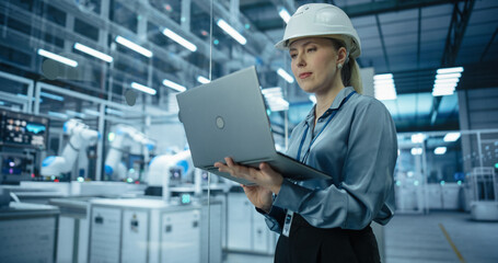Portrait of a Female Engineer in a Hard Hat Working in an Industrial Facility. Industrial Manager...