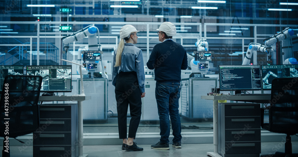 Poster system administrator and technician working at a manufacturing plant. male specialist programming th