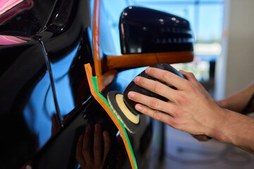 A Detailed Close Up of the Car Polishing Process in the Field of Automotive Detailing