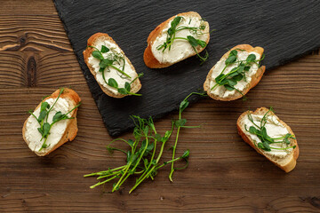 Sandwiches with fresh sprouting microgreens. Sprouted peas seeds micro greens. Vegan food