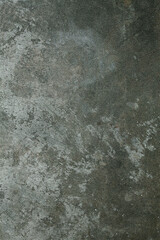 Dark gray textured background showing signs of wear and tear