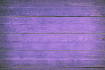 Purple painted wooden boards forming a textured background