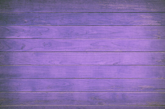 Purple painted wooden boards forming a textured background