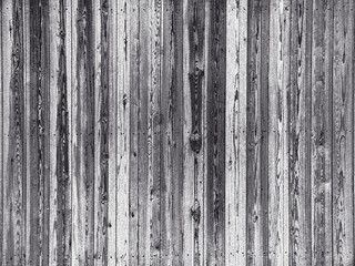 Fototapeta premium Weathered gray wood planks showing knots and grain creating rustic texture