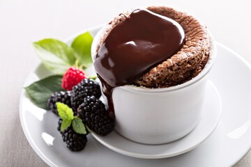 Chocolate souffle with thick chocolate ganache glaze