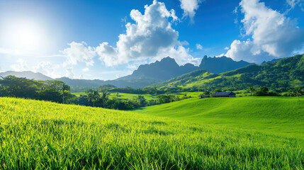 Fototapeta premium Lush green landscape featuring rolling hills, vibrant grass, and majestic mountains bright blue sky with fluffy clouds. scene evokes sense