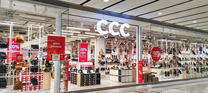 POLAND, BYDGOSZCZ - January 10, 2025: CCC shoes, bag and and accessories store entrance. A brightly lit store in a shopping mall. Red promotional signs with percentages off.