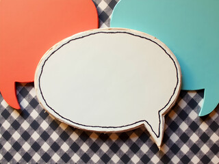 Vibrant Speech Bubbles on Gingham, A Colorful Dialogue of Communication, Creative Expression and Conceptual Design, ideal for messaging, and conversational visuals