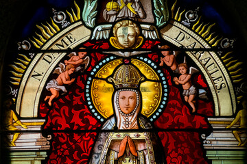 Stained glass (19th century) of Virgin Mary at prayer.