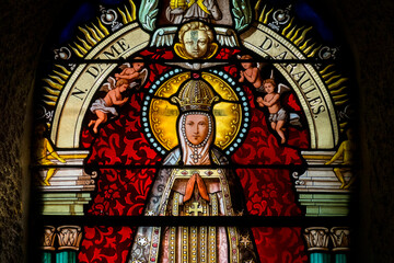 Stained glass (19th century) of Virgin Mary at prayer.