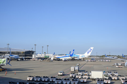 Narita, Japan &ndash; April 9, 2025: All Nippon Airways (ANA) aircraft being serviced, parked at passenger gate at Narita International Airport (NRT), Tokyo.