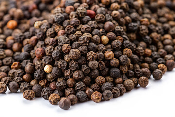 Raw Black Pepper Grains on a White Surface