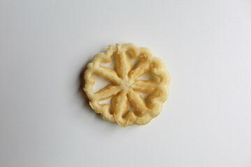 Kembang goyang cake, traditional snack from Indonesia. Fried dough in wheel or flower shaped. Isolated on white backgroun