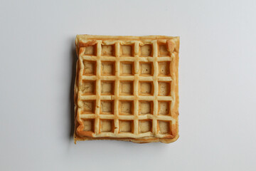 One plain square waffle cake, isolated on white background, flat lay or top view