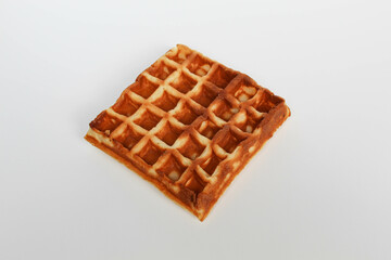 One plain square waffle cake, burnt side, isolated on white background